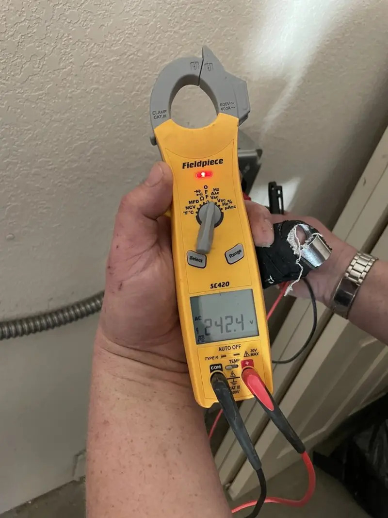 Voltage testing with clamp meter during Generator Installation in Marble Falls